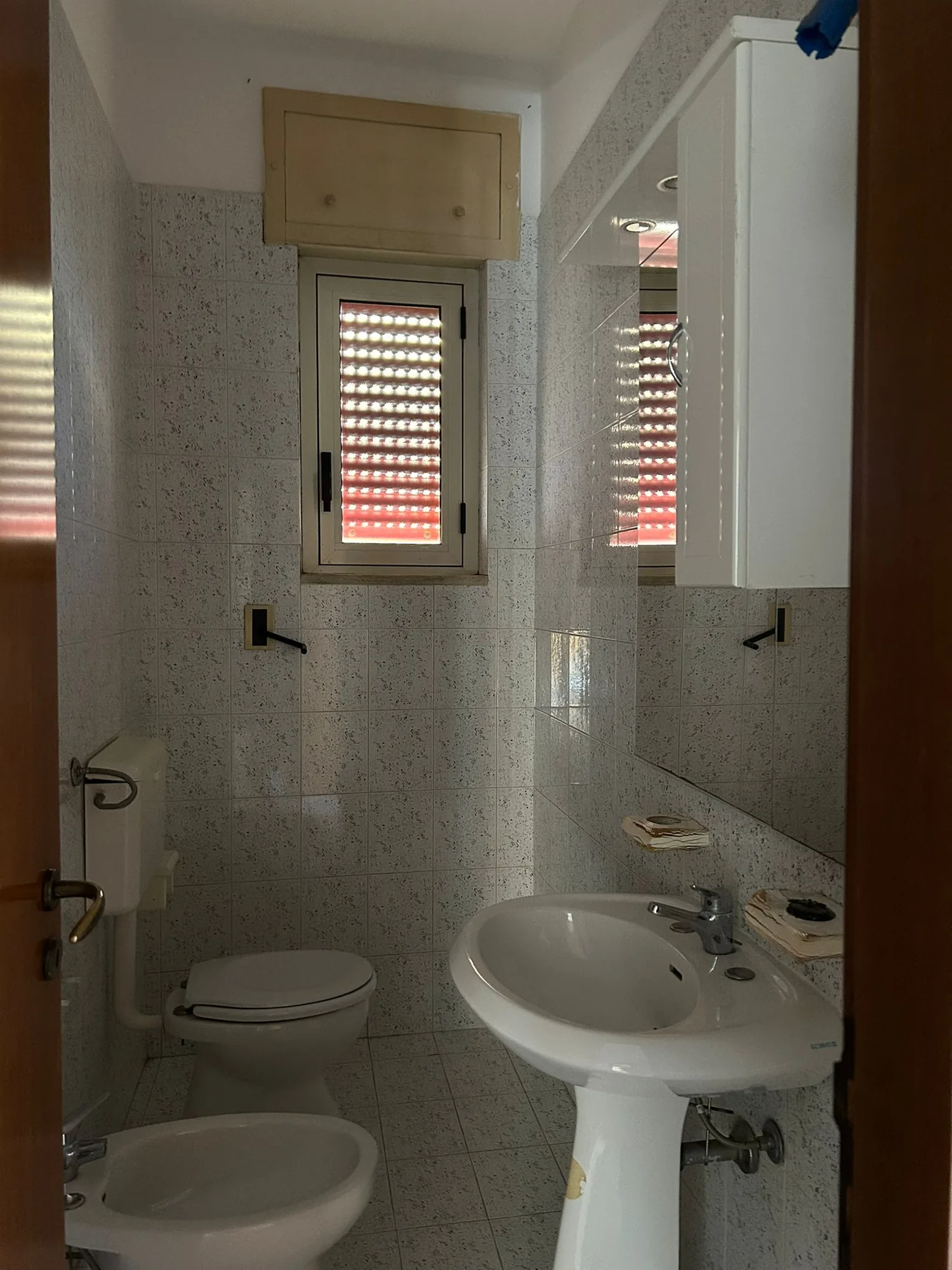 The second bathroom before the works, with shower and sanitary fixtures to be replaced