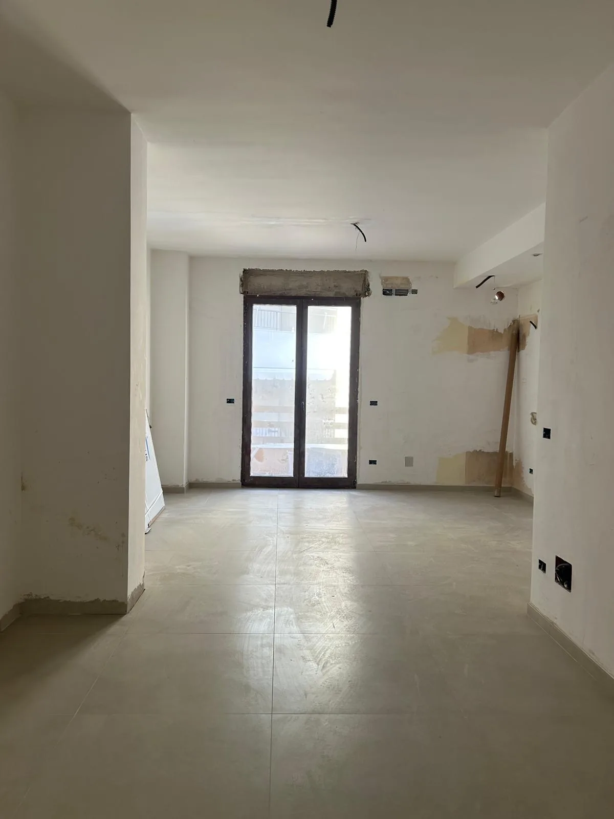 The construction site with the new floor laid and the walls still unfinished
