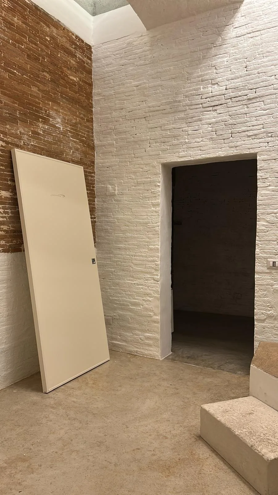 The new doors waiting to be installed, in the already painted rooms
