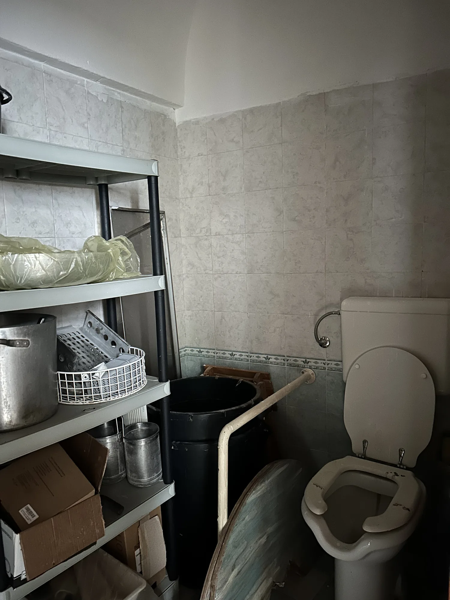 The old bathroom used as storage, before the renovation