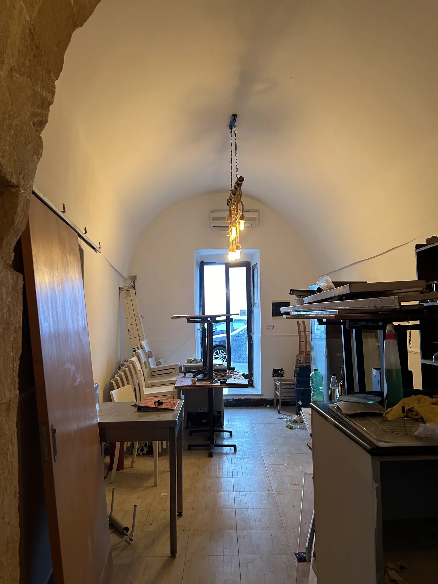 The narrow, vaulted room in the configuration prior to the project
